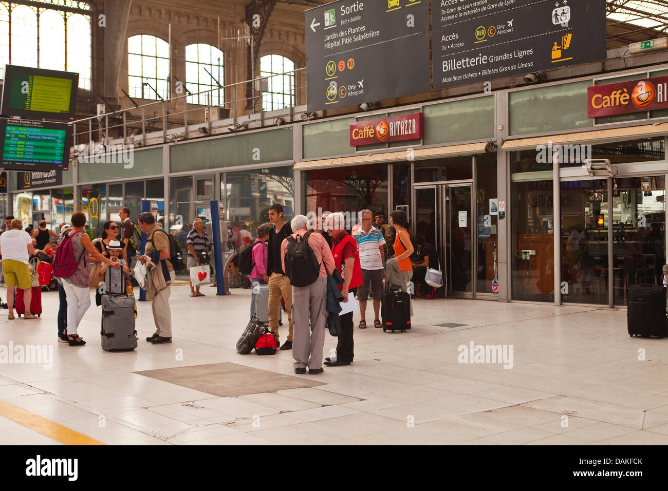 Paris, France. 15th July, 2013. People anxiously wait for information on their trains at Paris Austerlitz railway station as the derailment at Bretigny-sur-Orge continues to cause problems three days on in Paris, France, Monday July 15th, 2013 Credit:  Julian Elliott/Alamy Live News Stock Photo
