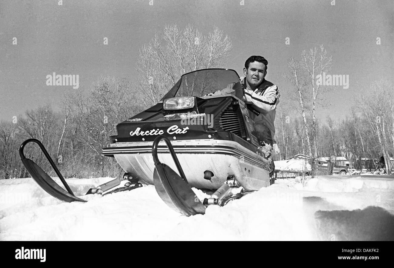 Race car driver Al Unser, 1939--,  on a snowmobile at his ranch in Chama, New Mexico, circa January, 1973 Stock Photo