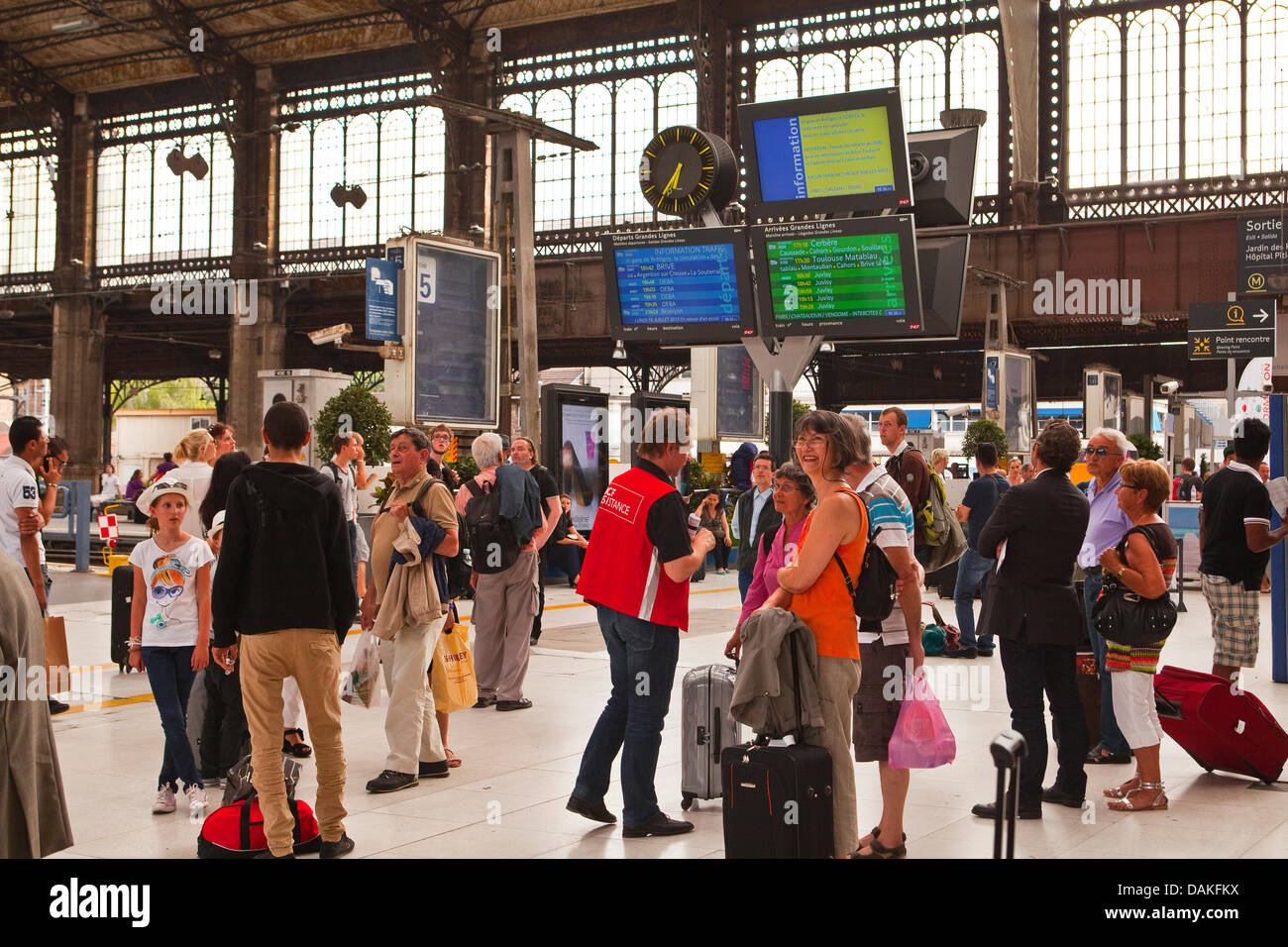 Paris, France. 15th July, 2013. People anxiously wait for information on their trains at Paris Austerlitz railway station as the derailment at Bretigny-sur-Orge continues to cause problems three days on in Paris, France, Monday July 15th, 2013 Credit:  Julian Elliott/Alamy Live News Stock Photo