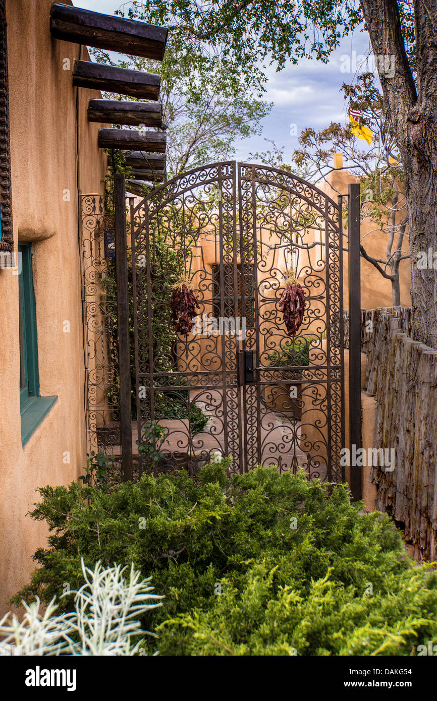 Wrought Iron Gate next to adobe wall in Santa Fe New Mexico USA