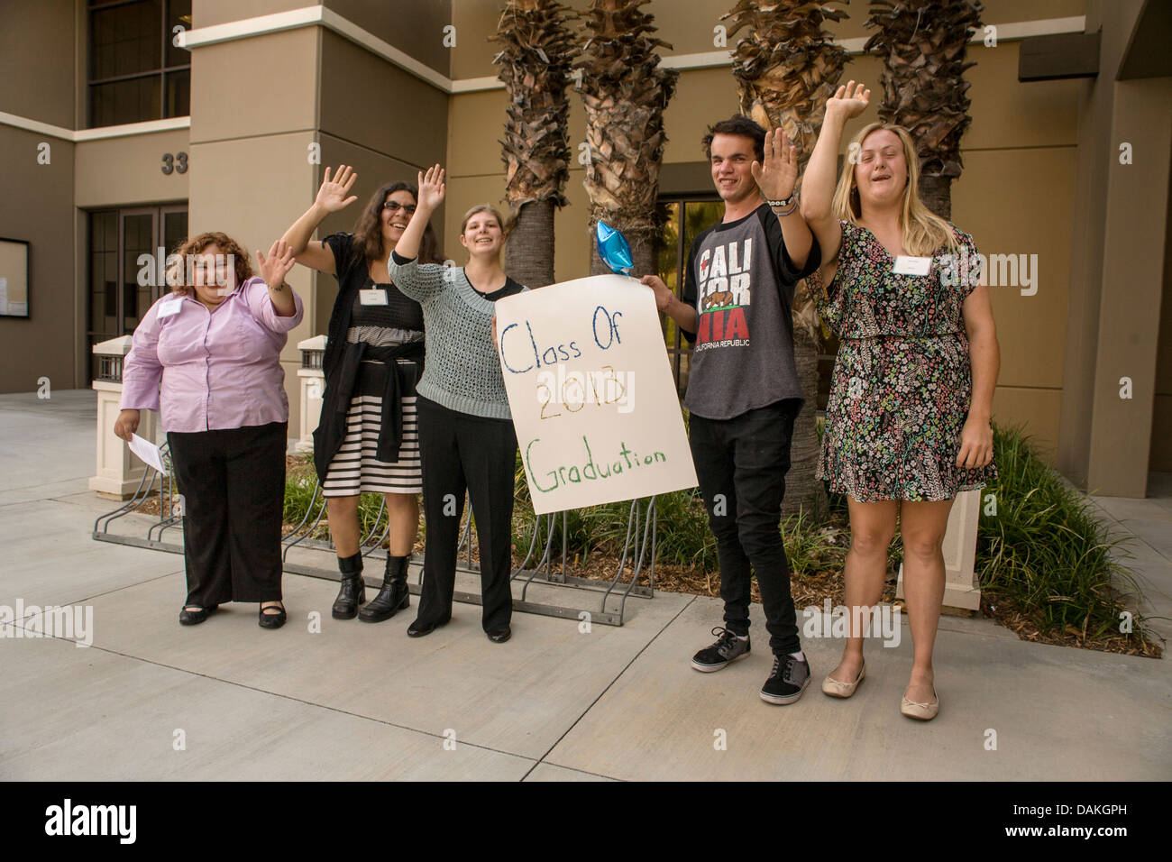 Handicapped Adult Transition Program (ATP) students proudly welcome guests to their graduation in San Juan Capistrano, CA. Stock Photo