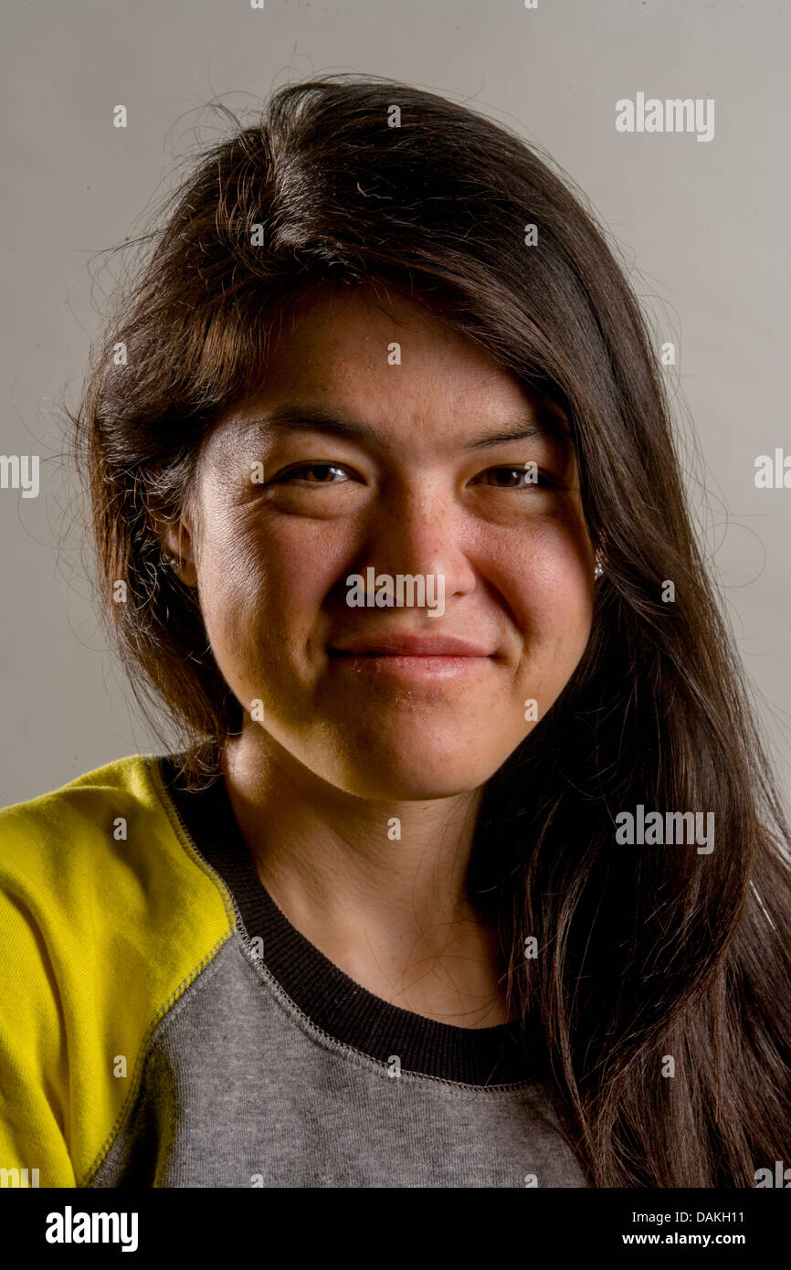 A happy racially-blended Asian-American 19-year-old girl smiles for her studio portrait in Laguna Niguel, CA. Stock Photo