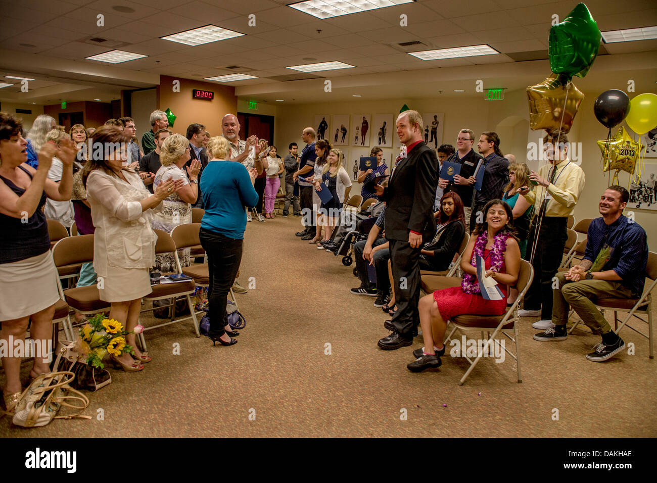 Family members cheer graduates of the Adult Transition Program (ATP) graduation in San Juan Capistrano, CA. Stock Photo