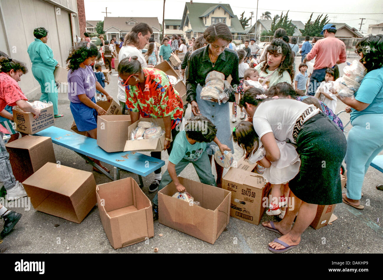 Hungry Hispanic and African American local LA residents fight over free  charity food after the 1992 Rodney King race riots Stock Photo - Alamy, image size:1300x952
