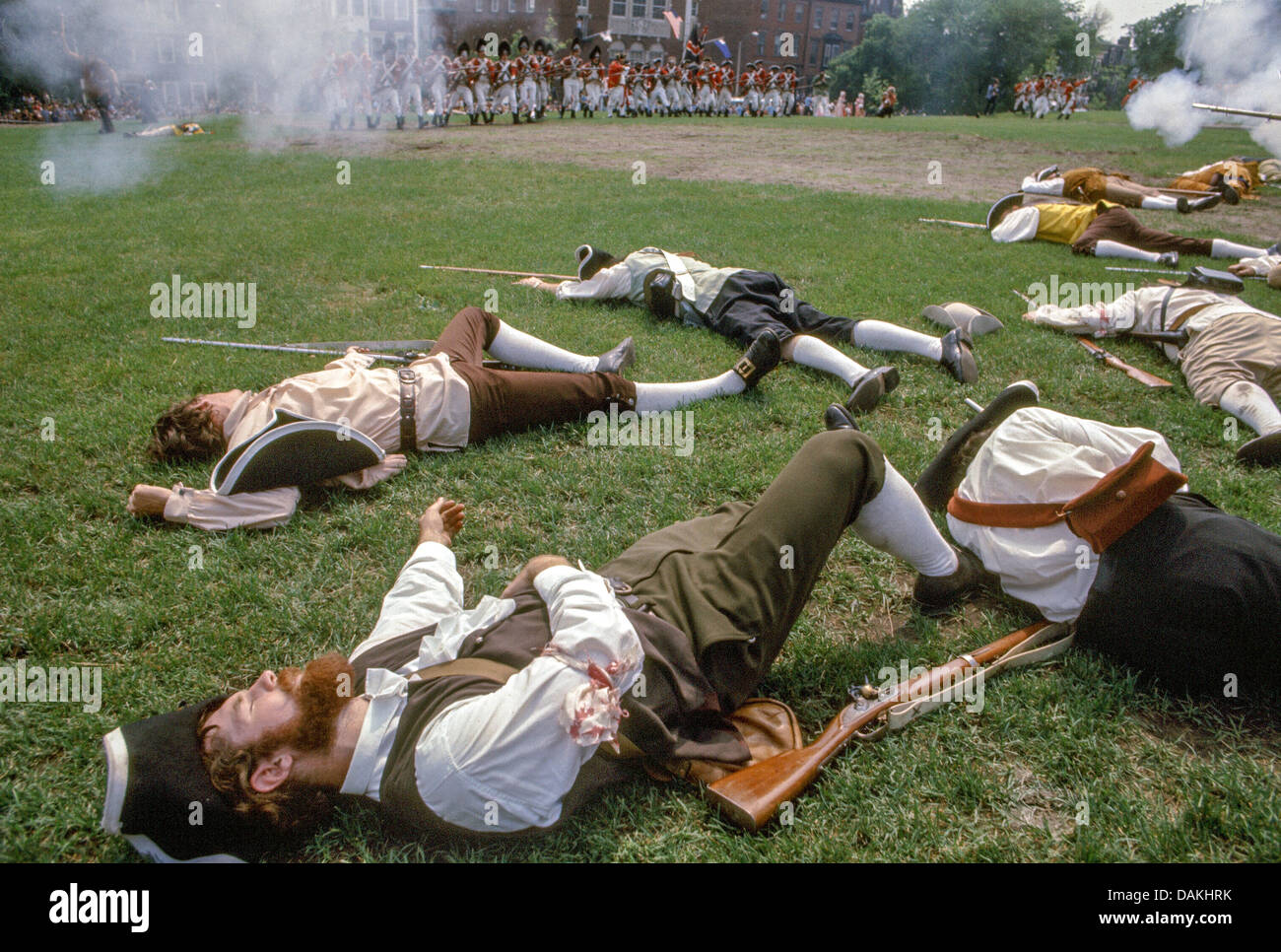 Patriots take casualties defending fortifications in a reenactment of the 1775 Battle of Bunker Hill, Charlestown, Massachusetts Stock Photo