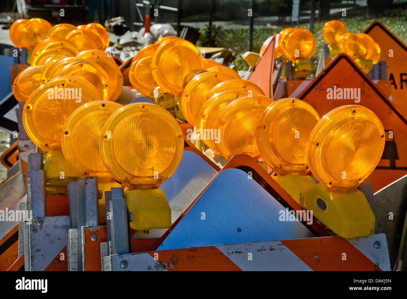 Orange safety warning lights are stacked ready for use at a California