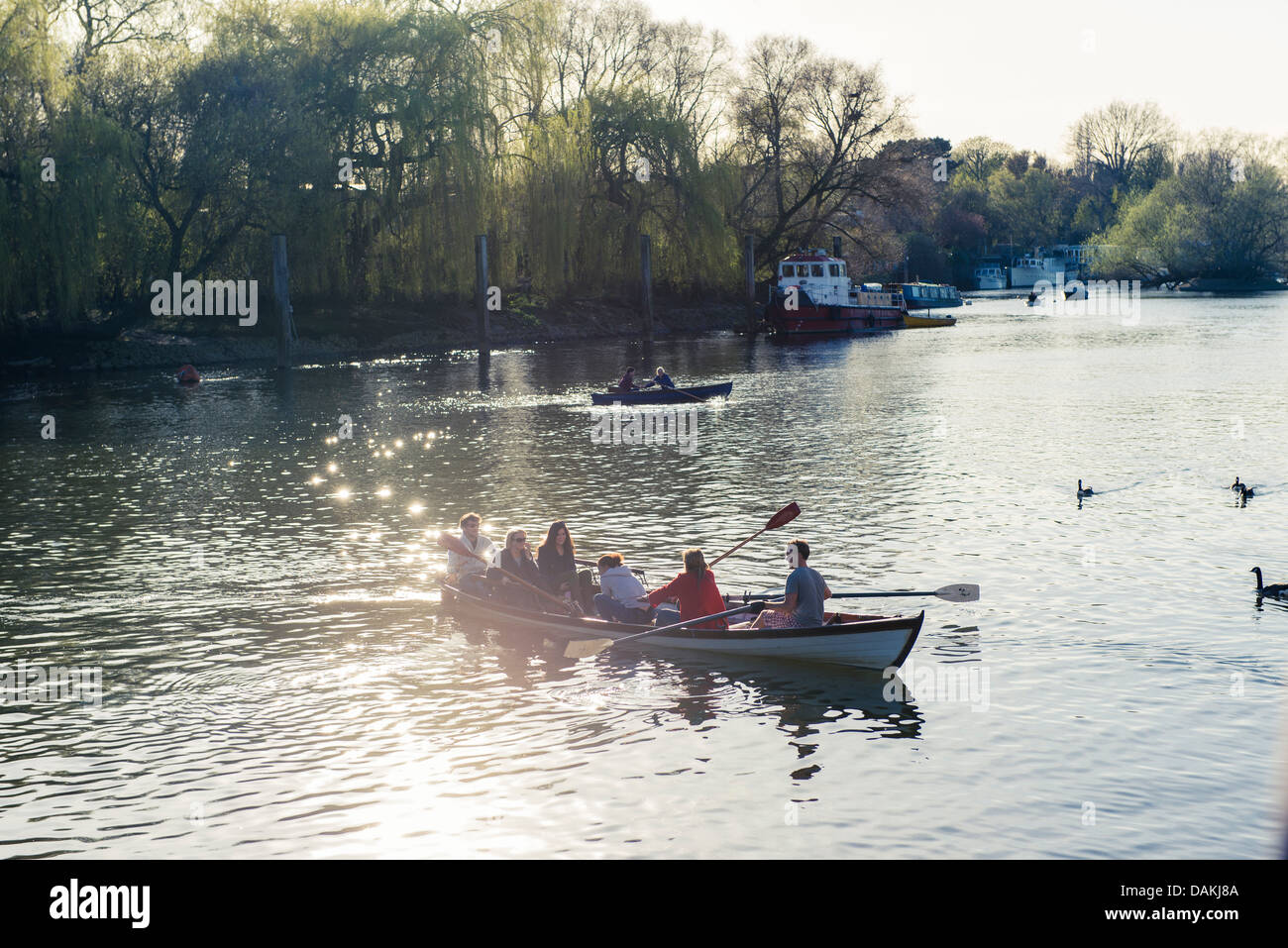 A family on a boat on the Thames in Richmond, London Stock Photo