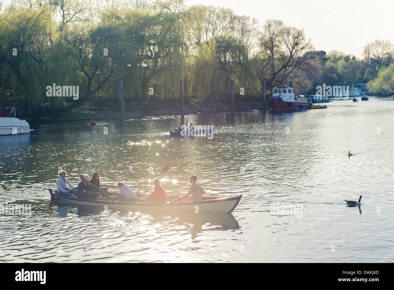 A family on a boat on the Thames in Richmond, London Stock Photo