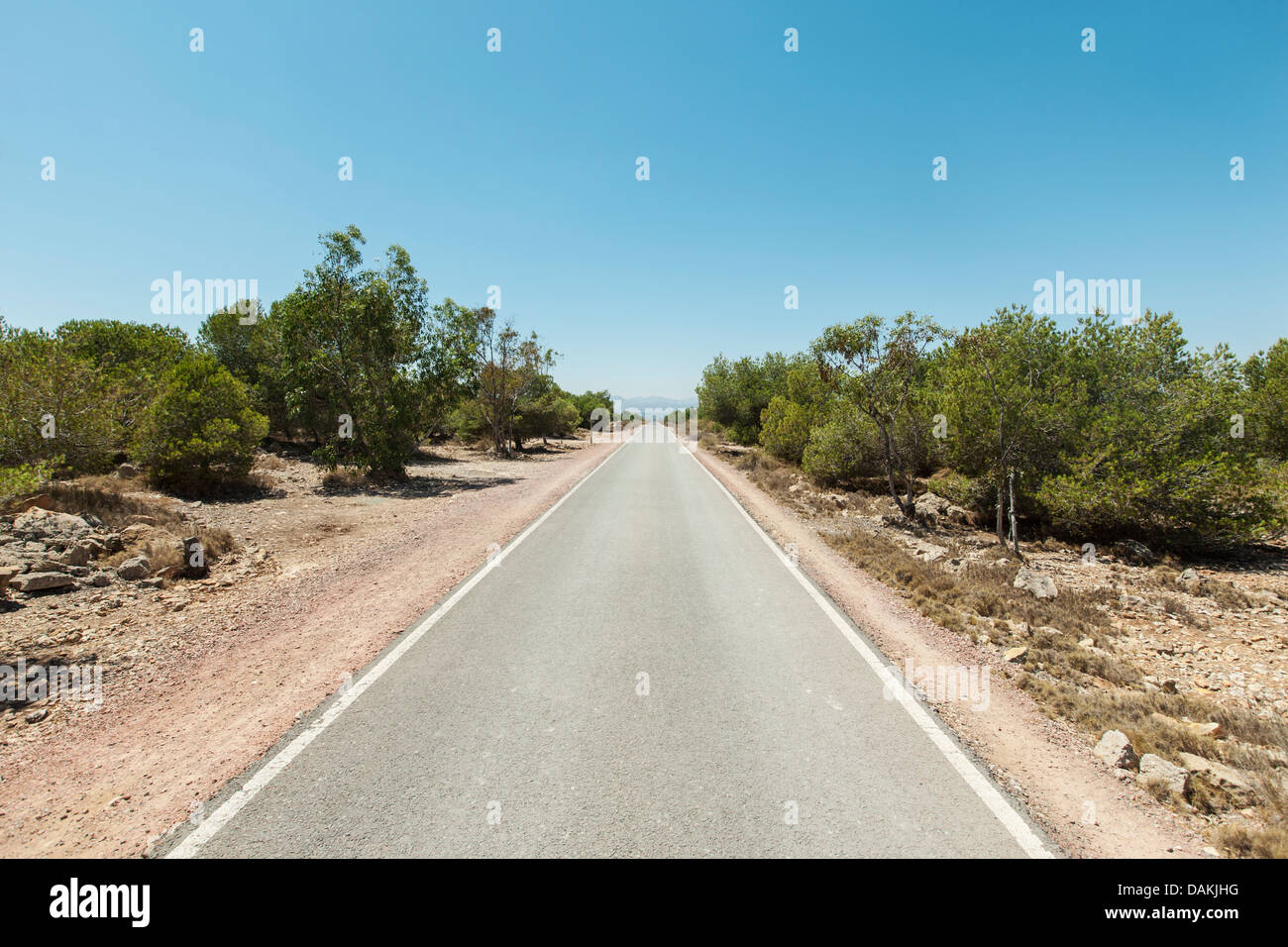 Simple country road in Spain leading into the unknown Stock Photo