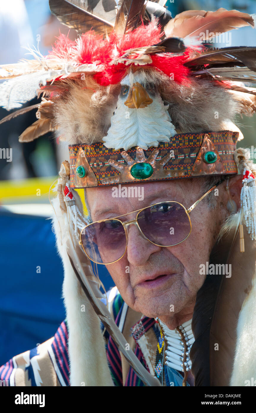 The proud Mohawk nation living in Kahnawake native community located on the south shore of the St Lawrence river in Quebec Canada celebrates it's annual Pow-Wow with traditional dances and drum music -July13-14 2013 Stock Photo