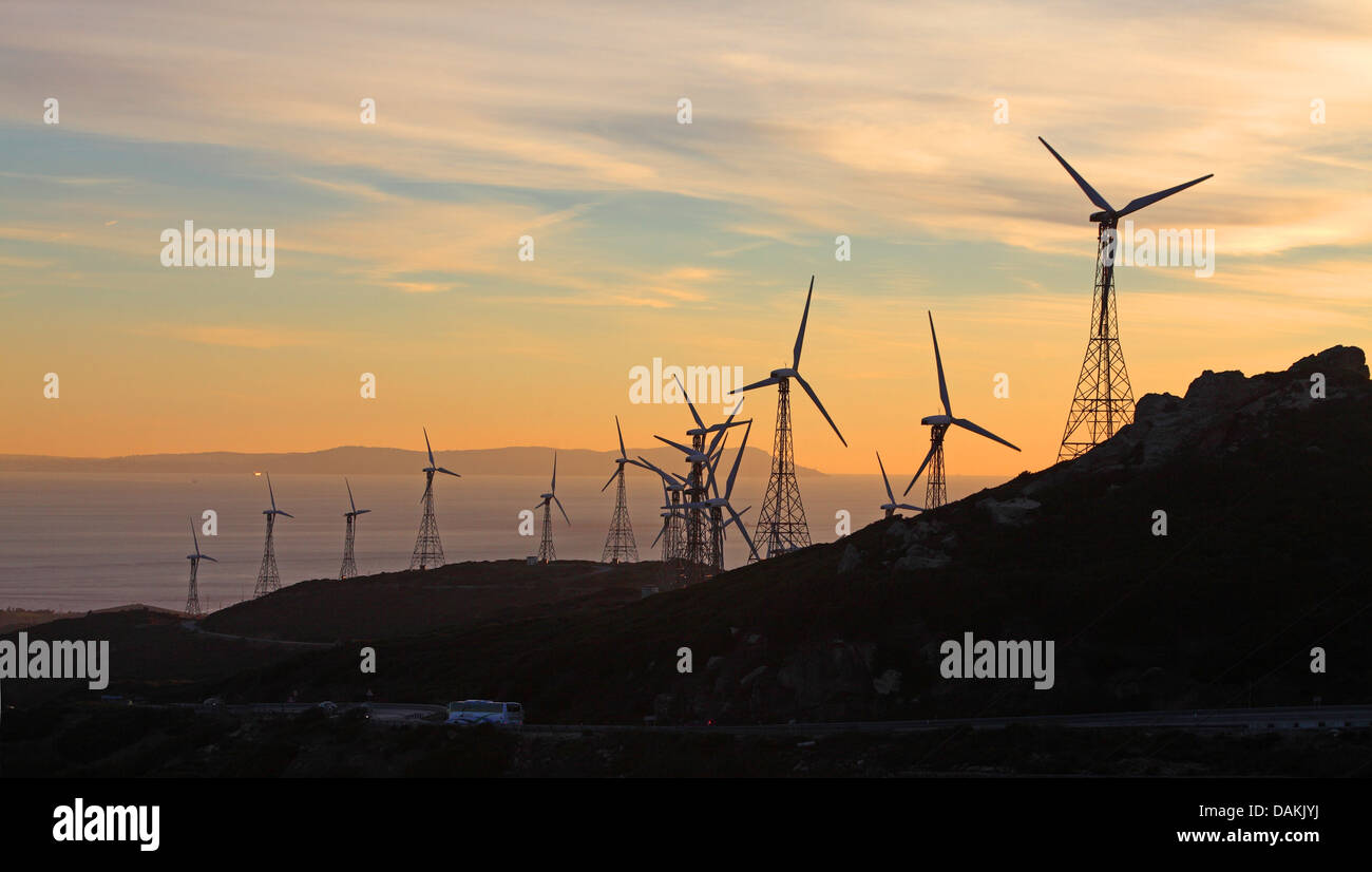 windmills in mountain range near the coast, evening mood, Spain, Andalusia, Tarifa Stock Photo