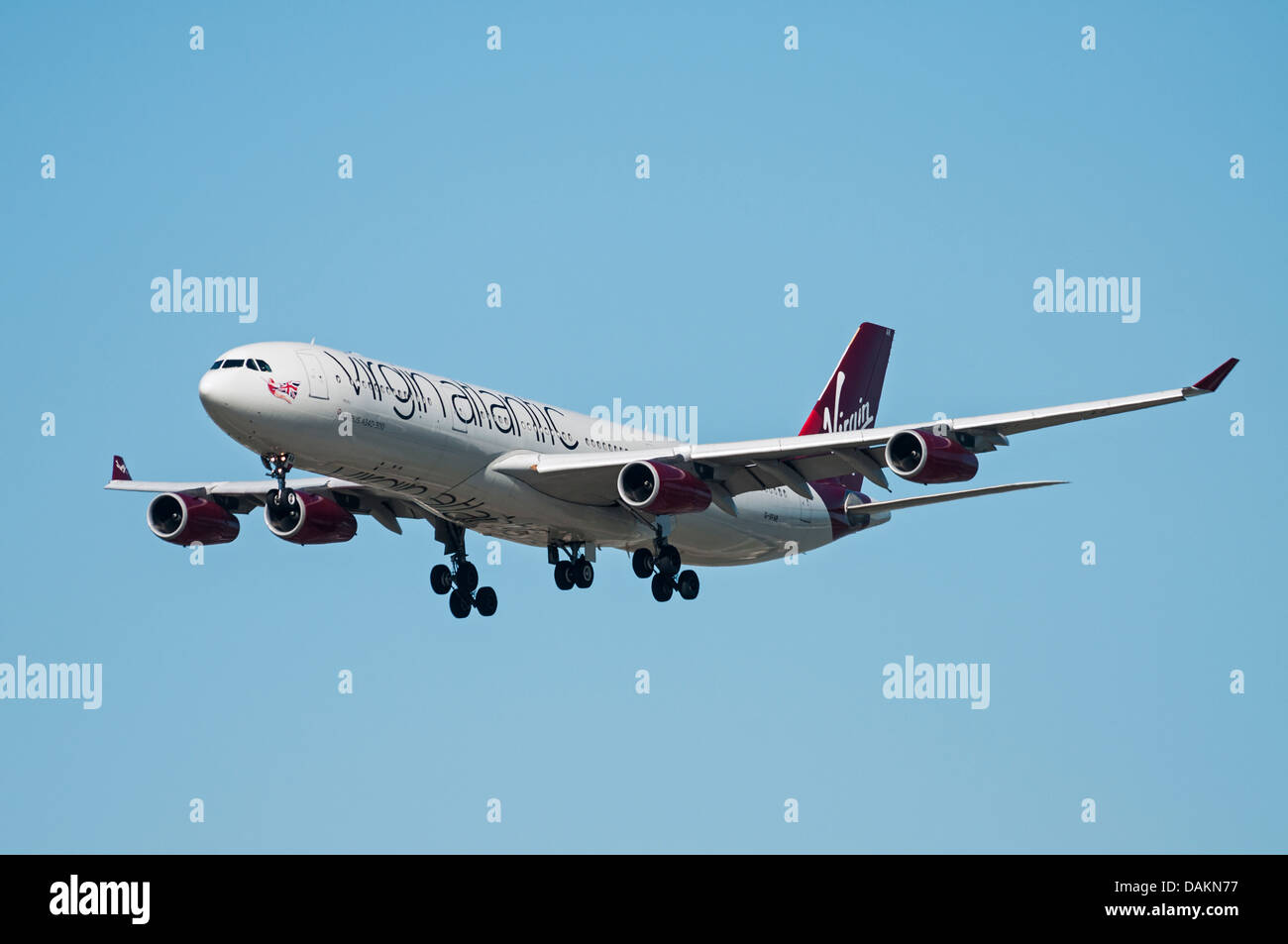 A Virgin Atlantic Airways Airbus A340-300 (313X) in flight and on final approach for landing. Stock Photo