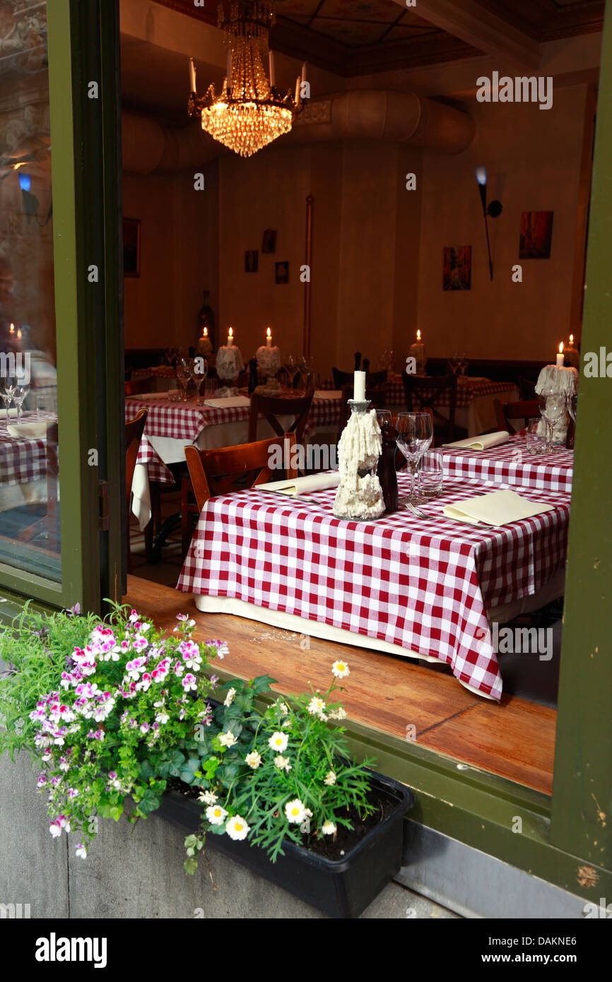 View into an empty restaurant through an open window Stock Photo - Alamy