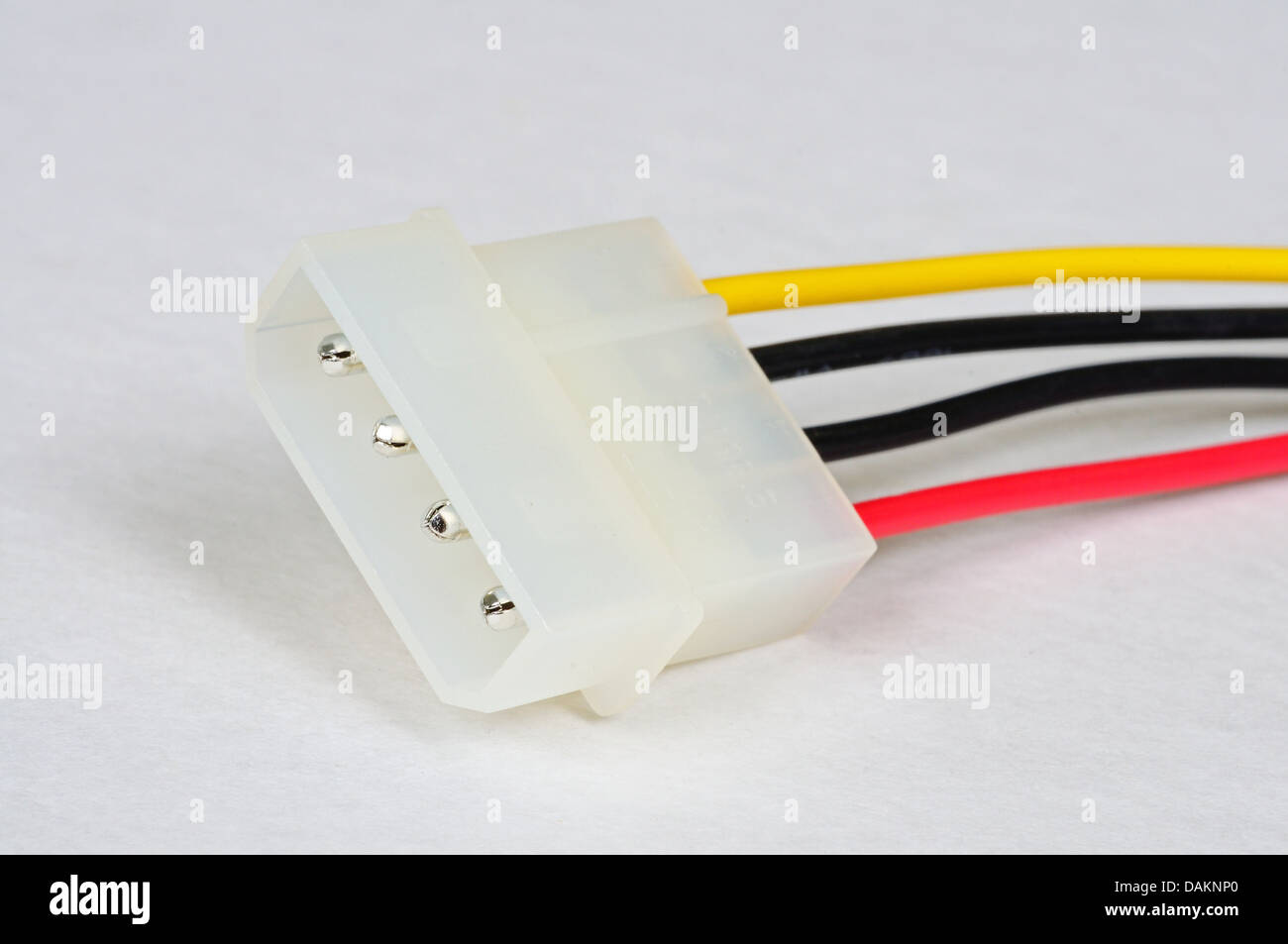 Four pin peripheral power connector from PSU in tower PC against a