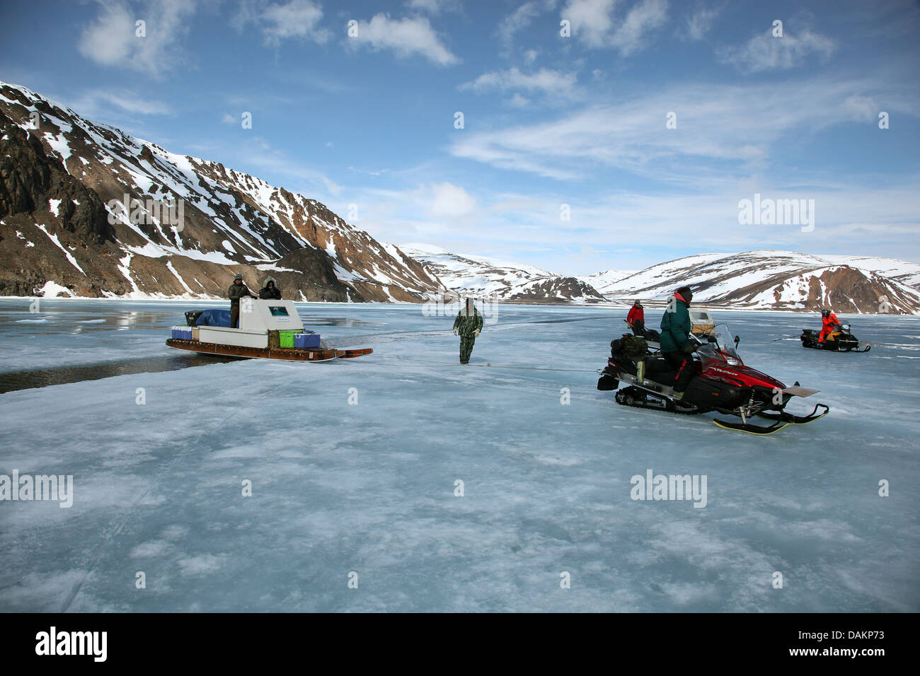 the Qamutik is being pulled over a crack in the ice, Canada, Nunavut Stock Photo