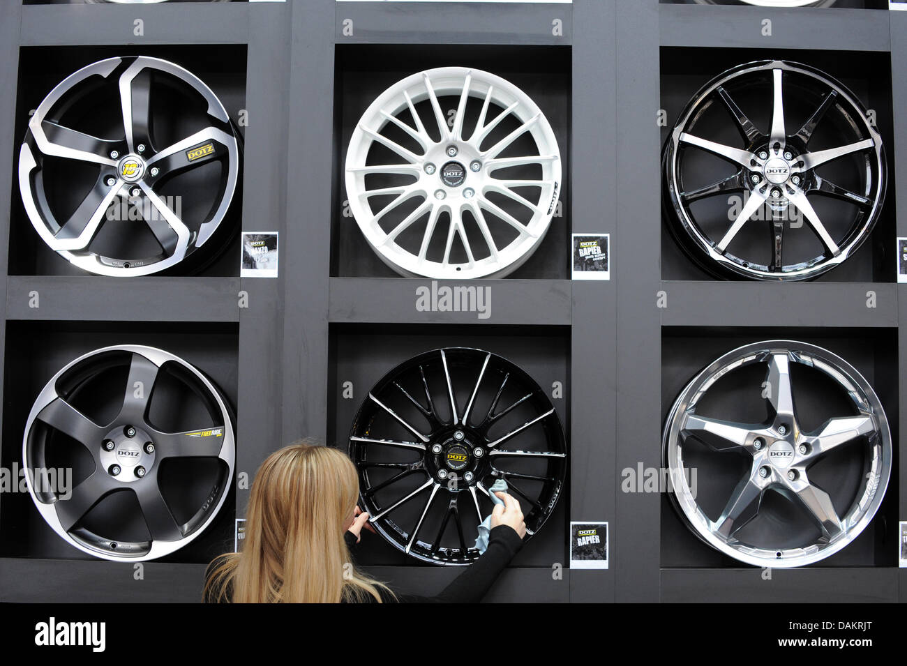 An employee of the Austrian wheel rim producer AEZ arranges the booth