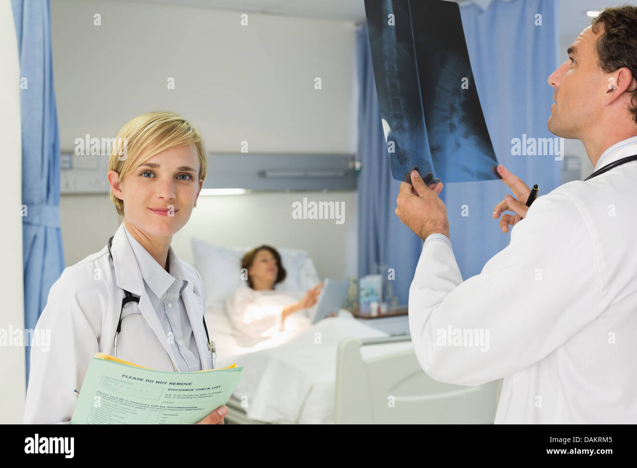 Doctors examining xrays in hospital room Stock Photo Alamy
