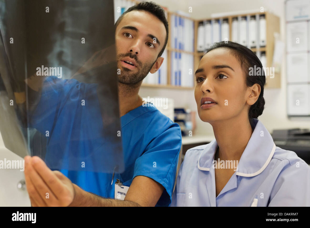 Nurses examining xrays in hospital Stock Photo Alamy