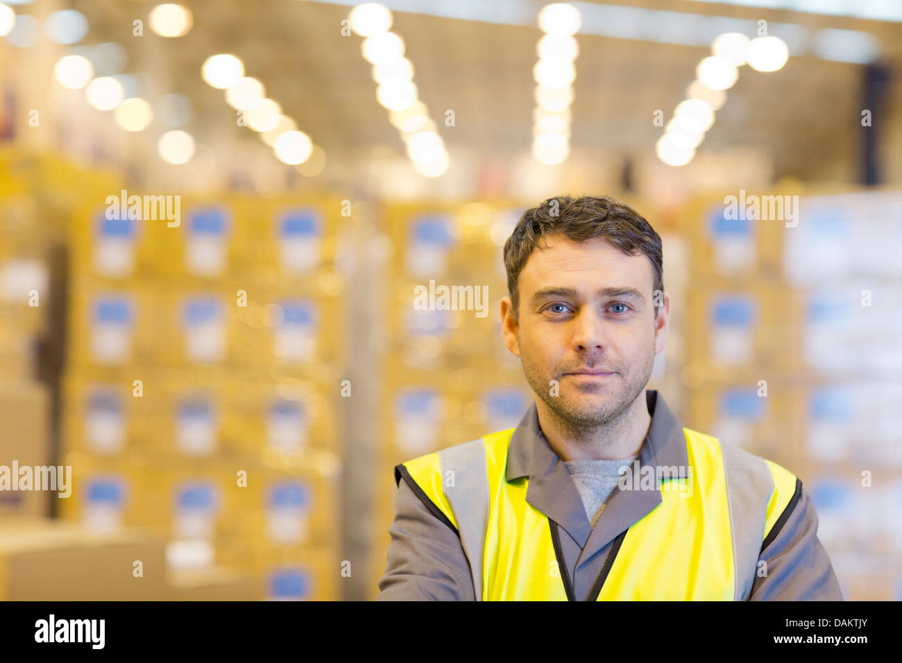 Worker standing in warehouse Stock Photo