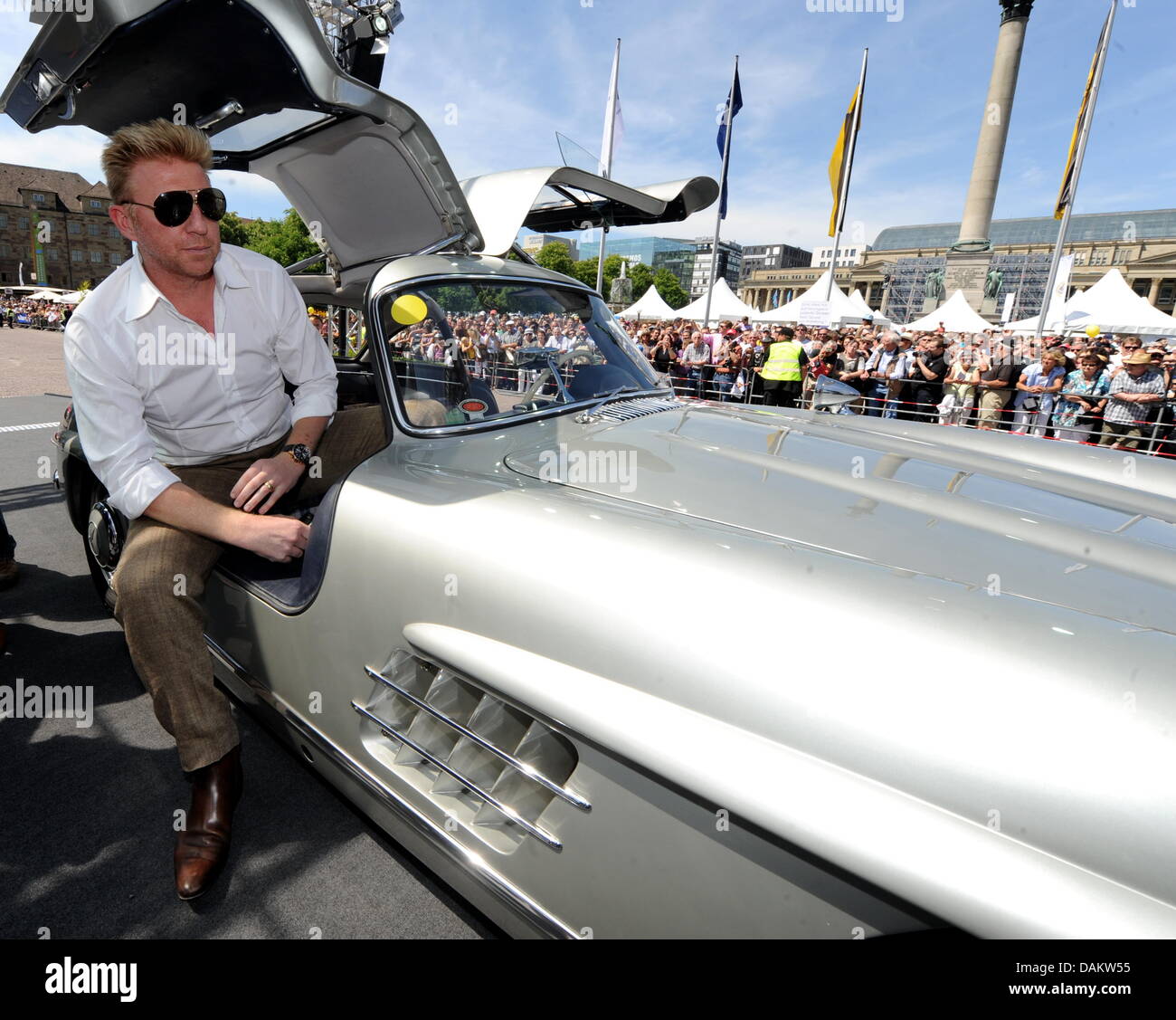 Former tennis pro Boris Becker in a Mercedes gullwing door classic car