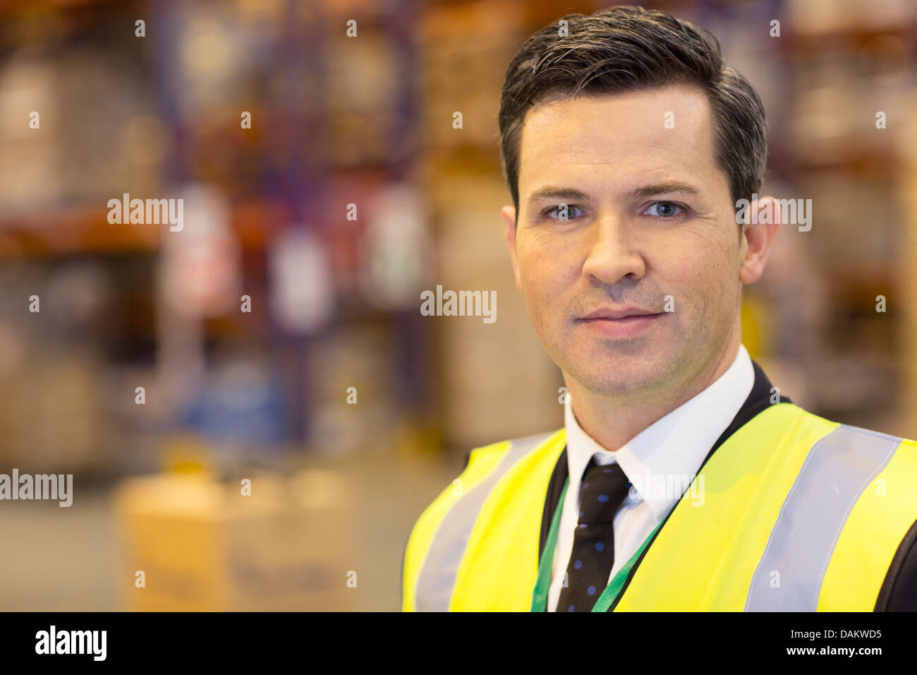 Businessman standing in warehouse Stock Photo