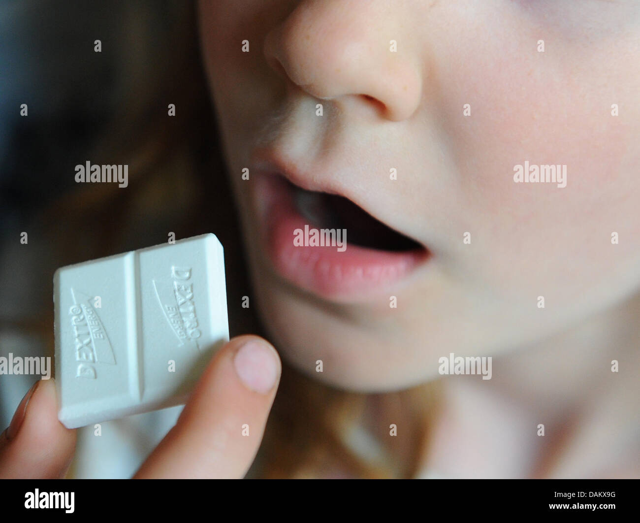 A girl who has diabetes type one eats grape sugar in Berlin, Germany