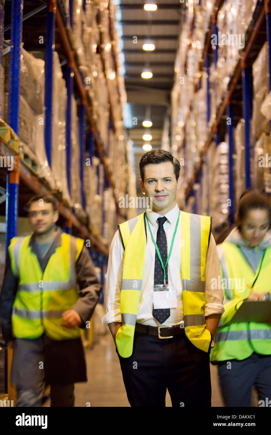 Worker standing in warehouse Stock Photo