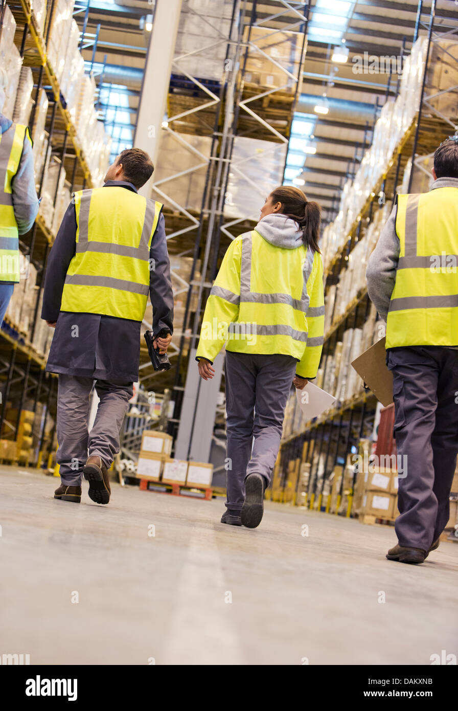 Workers walking in warehouse Stock Photo