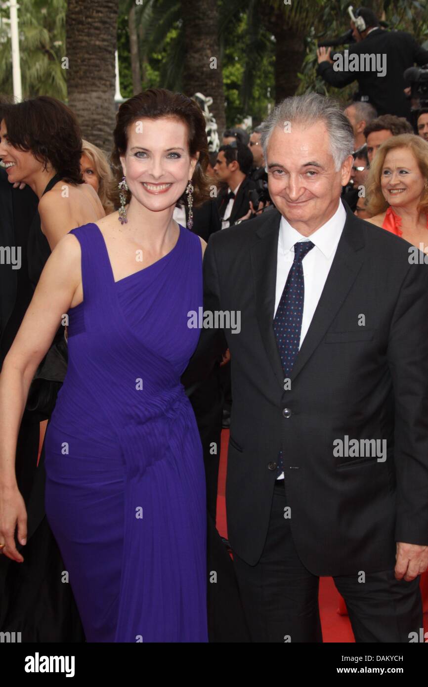 French actress Carole Bouquet and guest arrive at the premiere of 'Sleeping Beauty' at the 64th Cannes International Film Festival at Palais des Festivals in Cannes, France, 12 May 2011. Photo: Hubert Boesl Stock Photo