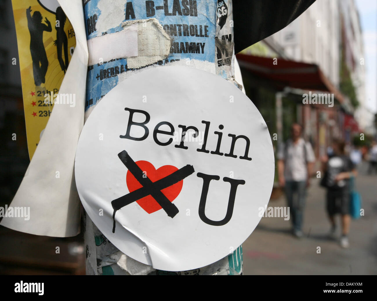 A sticker attached to a lamppost reads 'Berlin doesn't love You' in the ...