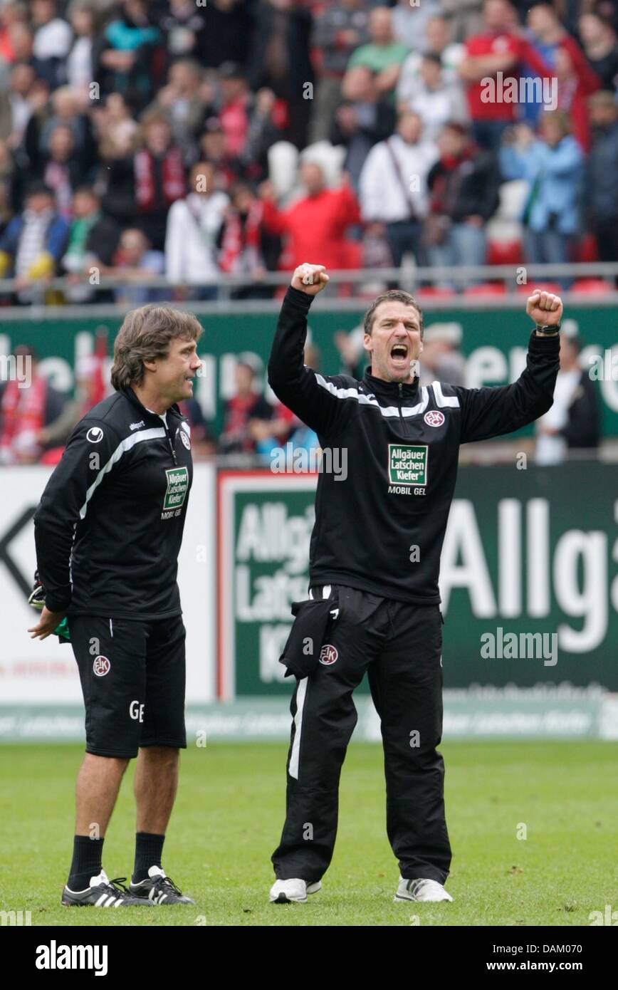 The head coach of Bundesliga soccer club Kaiserslautern, Marco Kurz (R), celebrates while standing next to his player Gerald Ehrmann after the Bundesliga soccer match between 1st FC Kaiserslautern and SV Werder Bremen at the Fritz-Walter-Stadion in Kaiserslautern, Germany, 14 May 2011. Kaiserslautern finishes the Bundesliga season 2010/2011 on seventh position in the league table.  Stock Photo