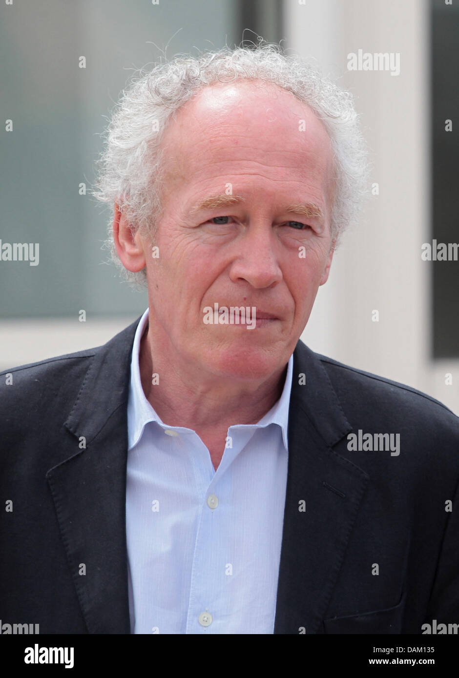 Belgian director Jean-Pierre Dardenne poses at the photocall of 'The Kid With A Bike'  at the 64th Cannes International Film Festival at Palais des Festivals in Cannes, France, on 15 May 2011. Photo: Hubert Boesl Stock Photo