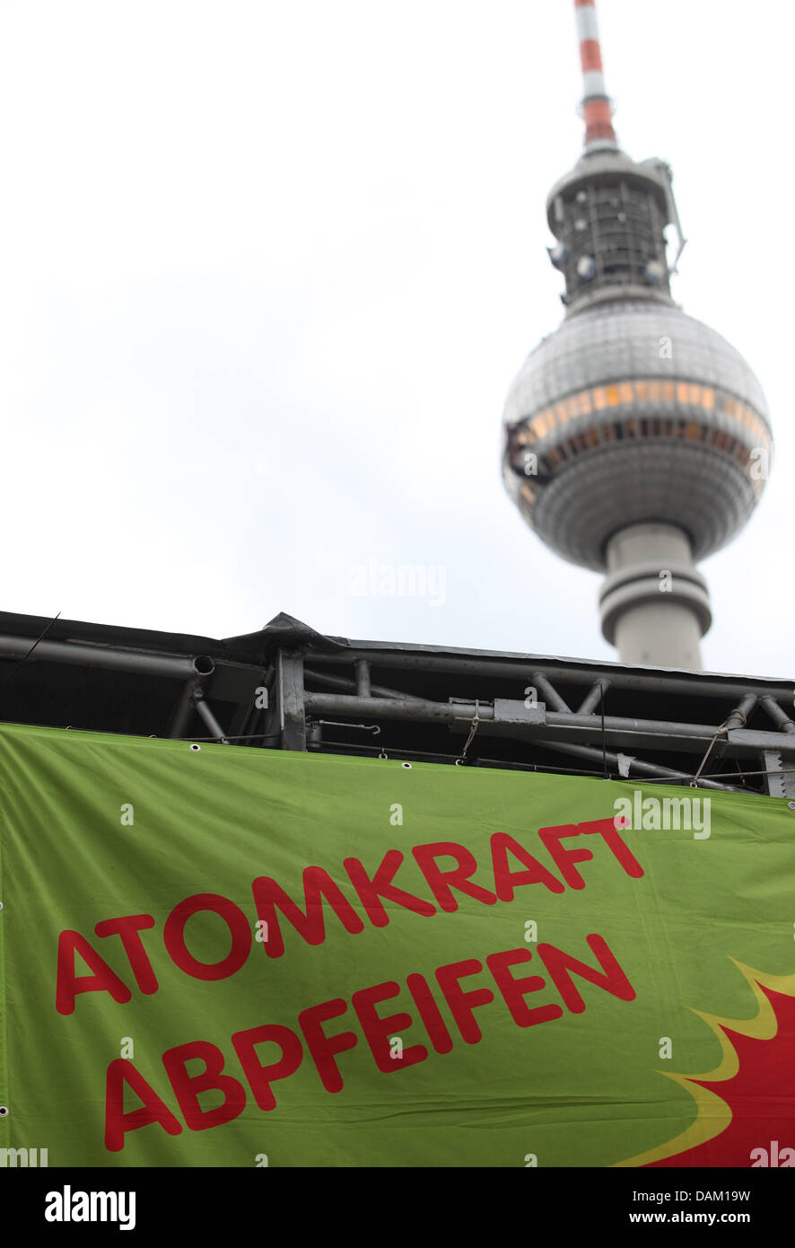 A banner titled 'Blow the whistle for nuclear power' is fixed in front of the television tower at Alexanderplatz in Berlin, Germany, 15 May 2011. According to the motto 'Meet nuclear power lobby, block nuclear power forum' a nuclear power protest camp will take place at Alexanderplatz that aims to protest against a meeting of the nuclear power lobby at the same time from 15 to 19 S Stock Photo