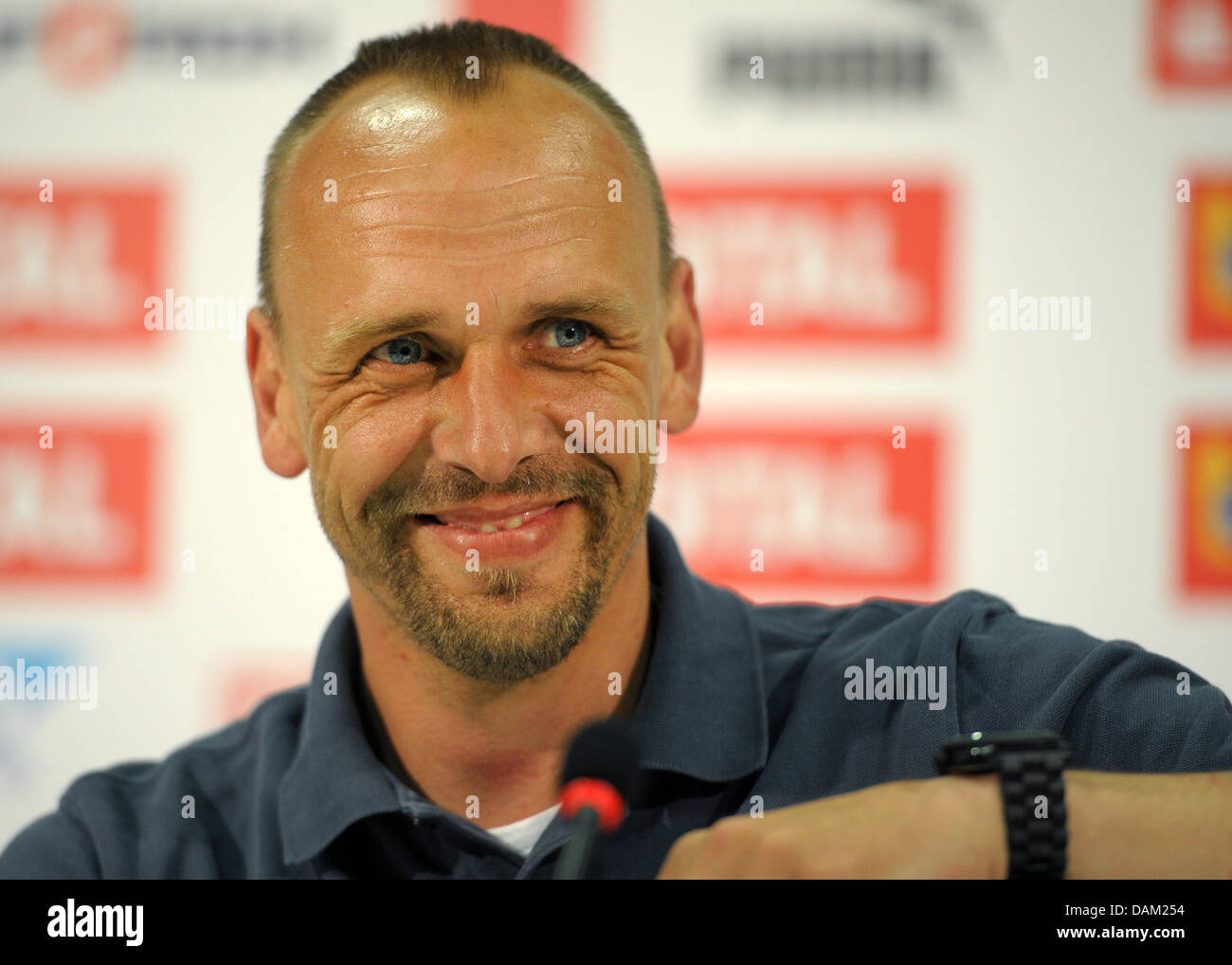 New 1899 Hoffenheim coach Holger Stanislawski smiles at a press conference in Zuzenhausen, Germany, 17 May 2011. Photo: RONALD WITTEK Stock Photo
