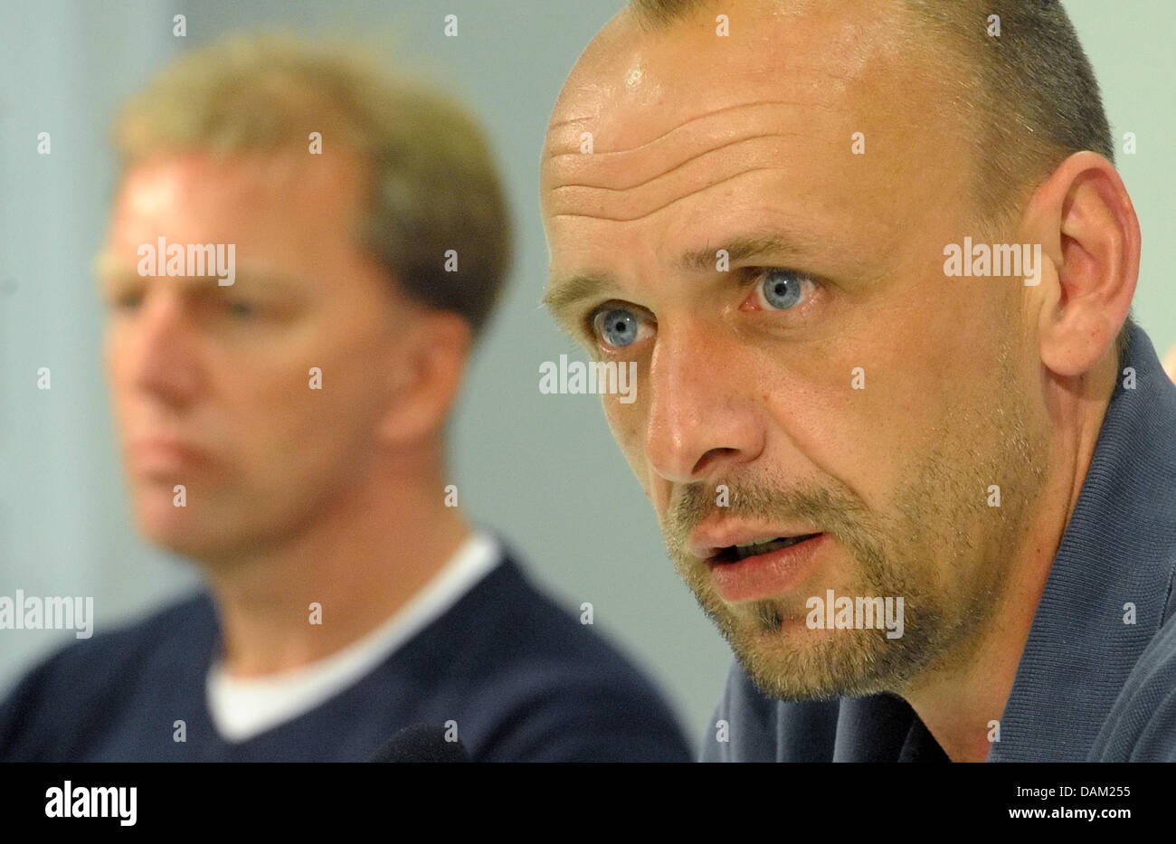 New 1899 Hoffenheim coach Holger Stanislawski (R) and his assistant Andre Trulsen attend a press conference in Zuzenhausen, Germany, 17 May 2011. Photo: Ronald Wittek Stock Photo