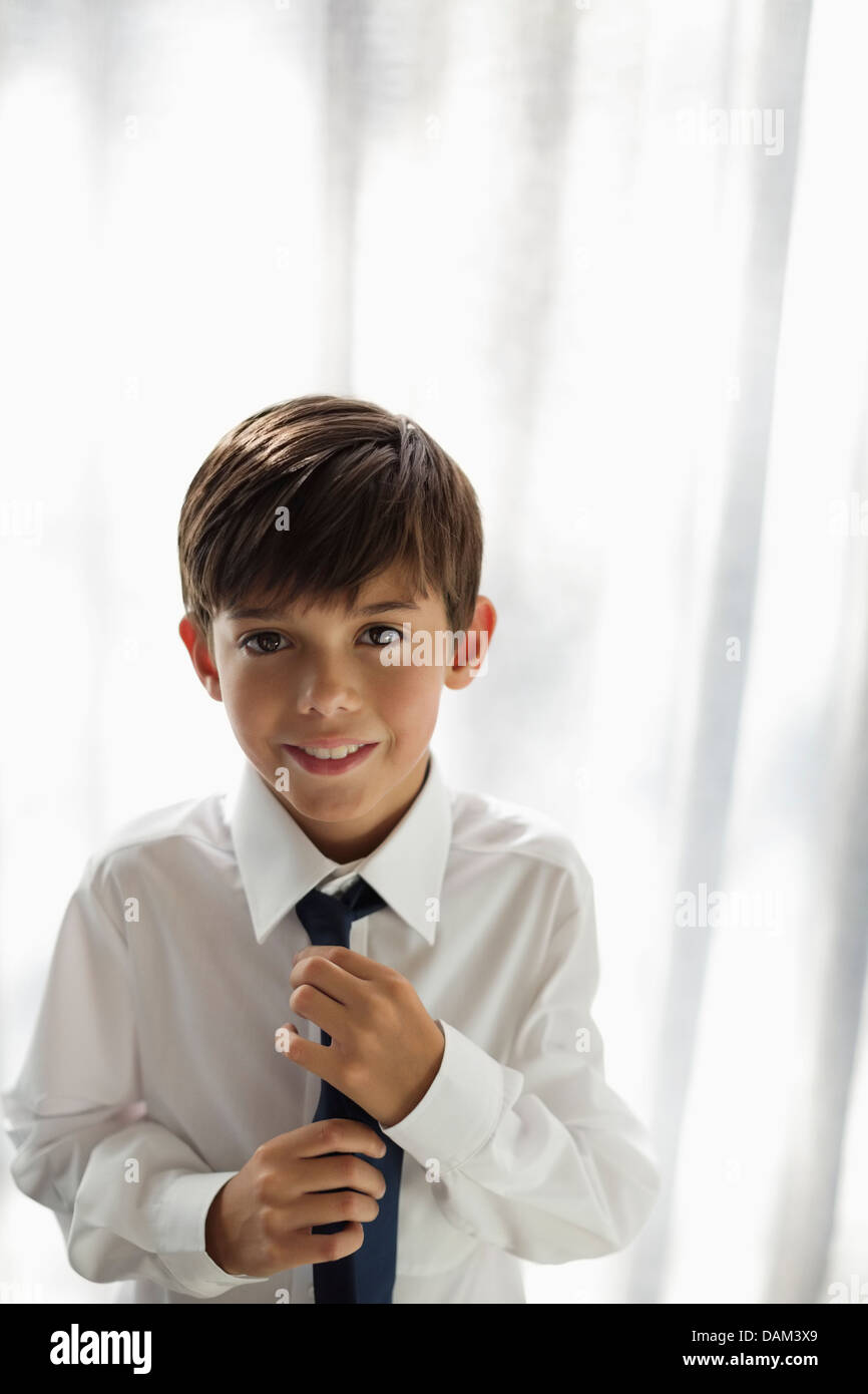Smiling boy wearing shirt and tie Stock Photo