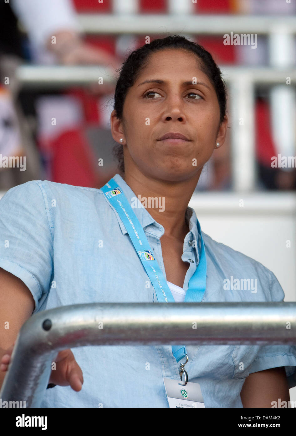 Steffi Jones, predsident of the organisation committee for the Women's World Cup 2011 and former soccer player, watches the soccer friendly match Germany vs. North Korea in Ingolstadt, Germany, 21 May 2011. Photo: Andreas Gebert Stock Photo