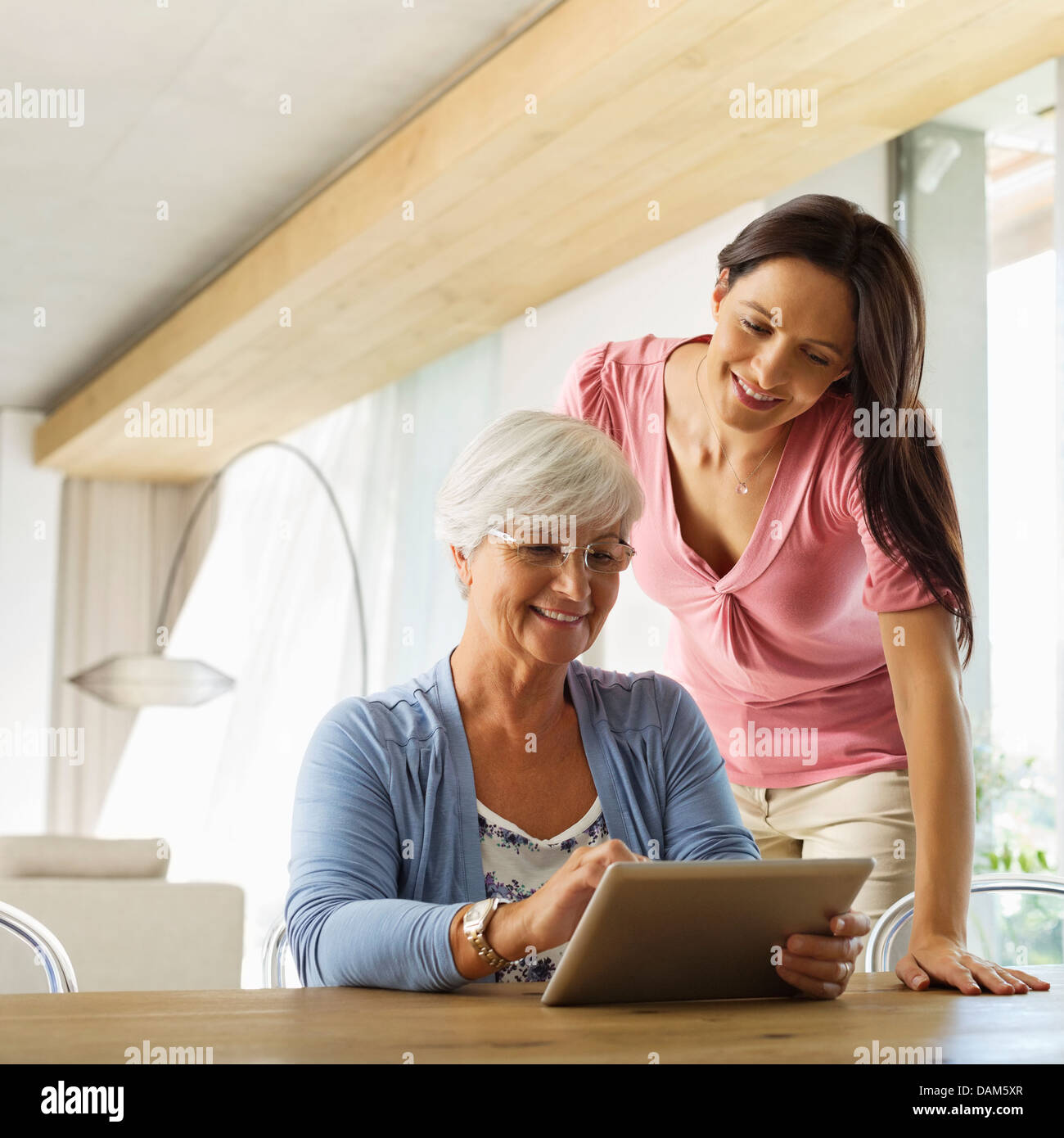 Mother and daughter using tablet computer Stock Photo