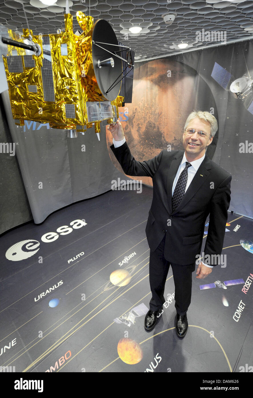 Thomas Reiter, the new director for manned spaceflight and mission operations of the European Space Agency (ESA) is pictured with a model of the space probe 'Mars Express' at the Control Centre ESOC of ESA in Darmstadt, Germany, 25 May 2011. The 52-year-old is responsible for the education and training of European astronauts, as well as Europe's contribition to the International Sp Stock Photo