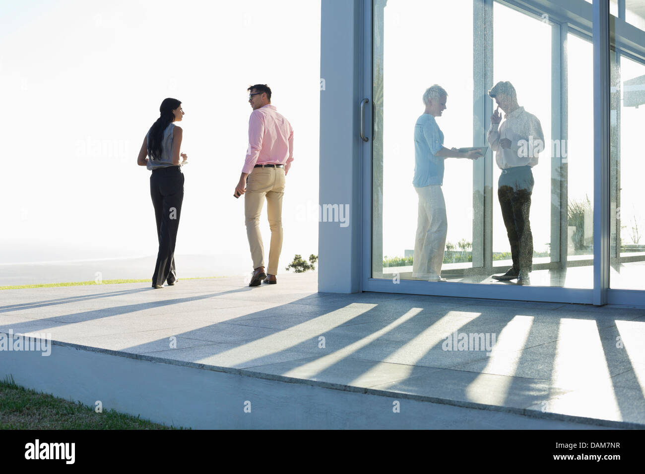 Business people talking outside office Stock Photo