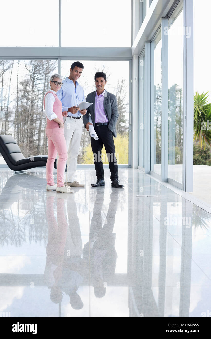 Business people smiling in office Stock Photo - Alamy