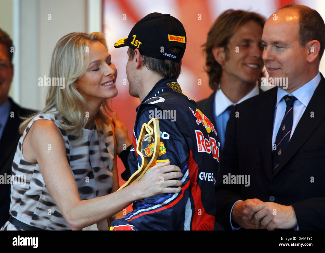 German Formula One Driver Sebastian Vettel C Of Red Bull Prince Albert Of Monaco R And His Girlfriend Charlene Wittstock On The Podium After The Grand Prix Of Monaco At The F1