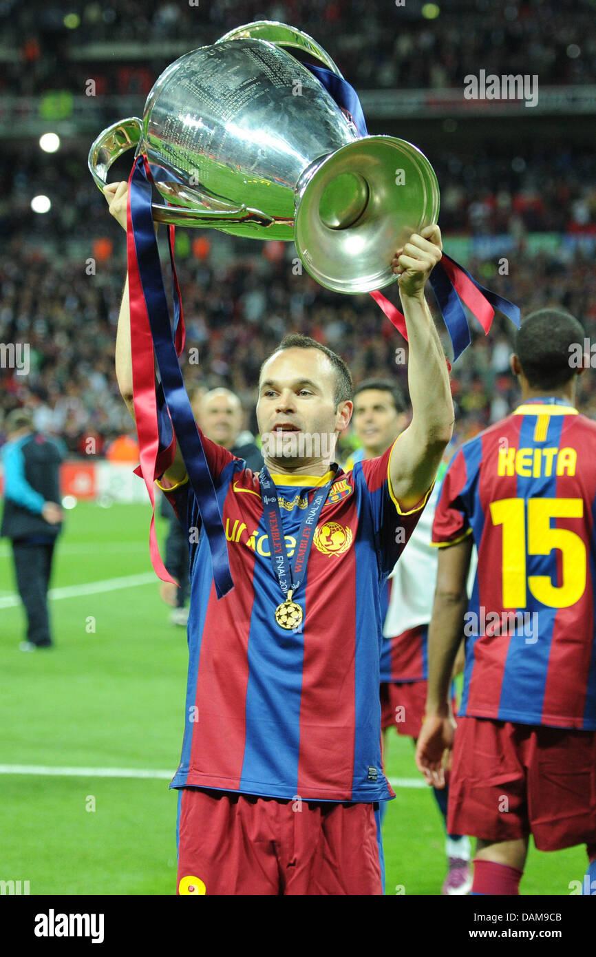 Barcelona's Andres Iniesta holds the Champions League ...