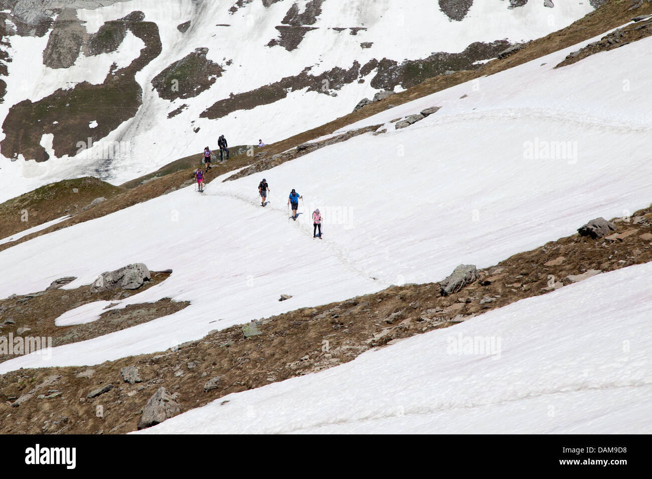 Hikers at Col du Bonhomme Stock Photo