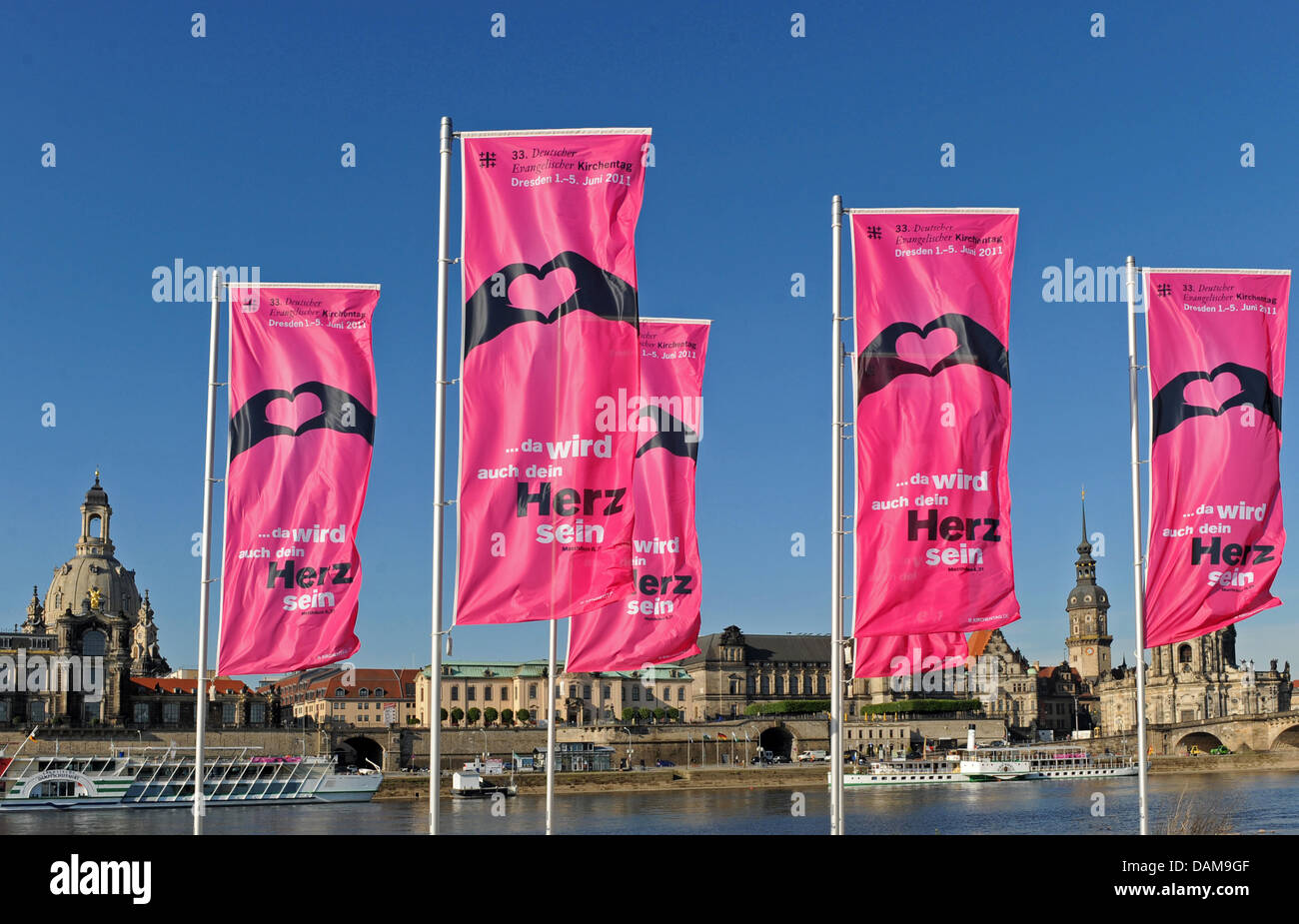 Flags of the Protestant Church Congress stand in front of the Church of Our Lady in Dresden, germany, 31 May 2011. The 33rd Protestant Church Convention will take place from 1 June to 5 June 2011. Photo: MATTHIAS HIEKEL Stock Photo