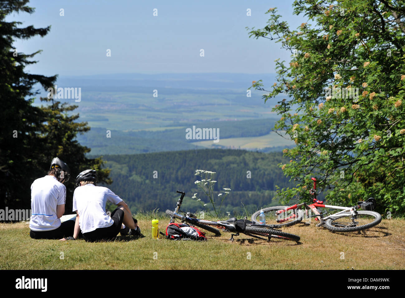 Two cyclists enjoy the view at the Feldberg, Germany, 26 May 2011. Photo: Marc Tirl Stock Photo