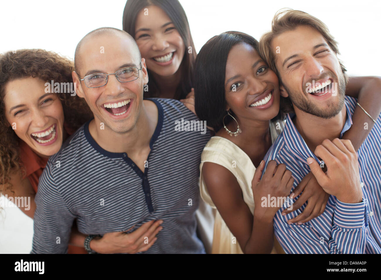 Friends smiling together Stock Photo - Alamy