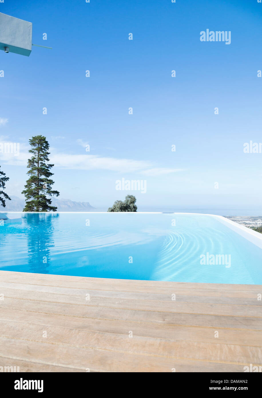 Infinity pool overlooking hillside Stock Photo