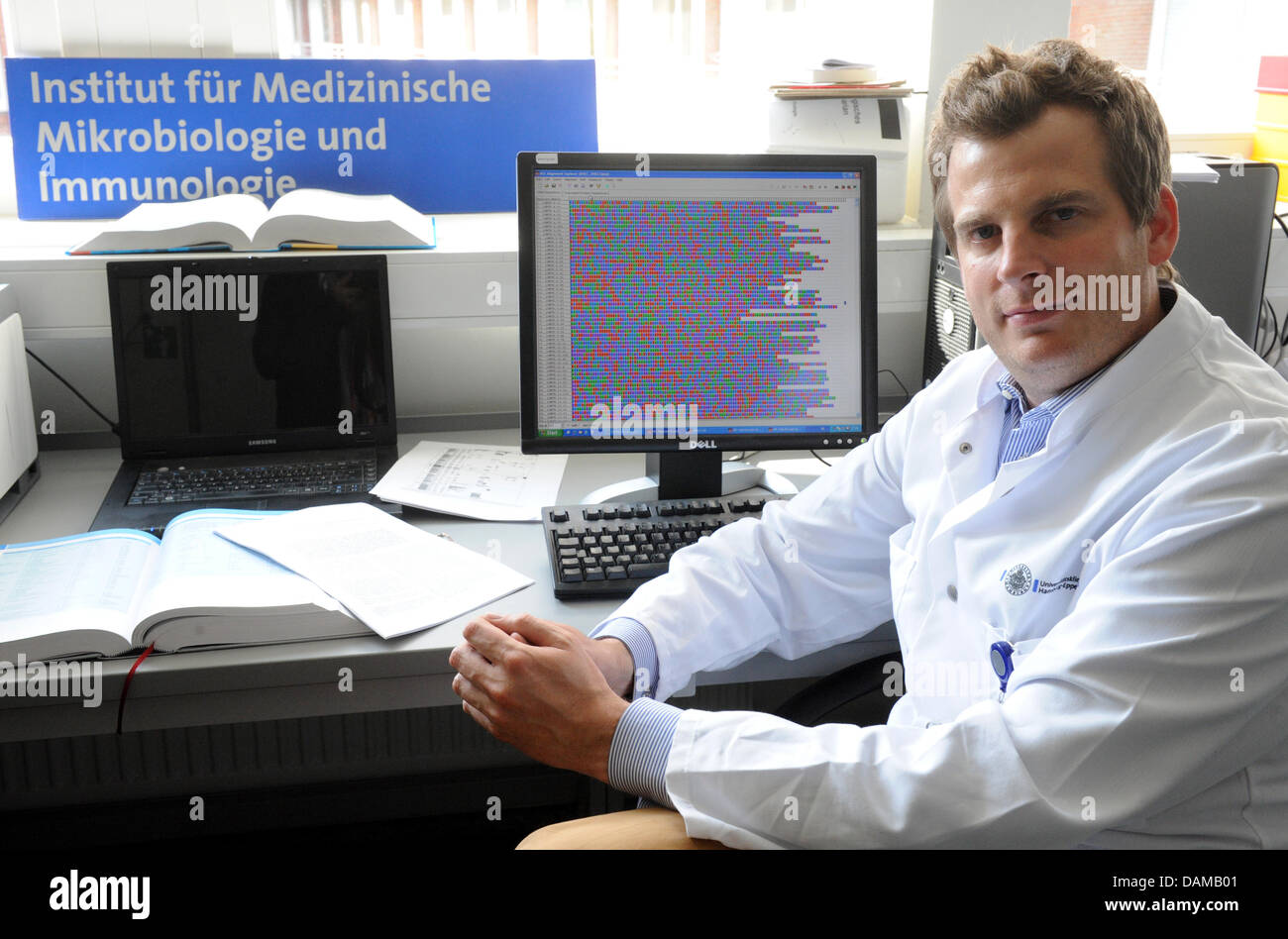 Bacteriologist Holger Rohde of the university hospital Eppendorf presents the decoded genome of the EHEC bacterium O104 on a computer screen at his laboratory in Hamburg, Germany, 2 June 2011. Rohde and Chinese experts have decoded the genome of the bacterium. Photo: Marcus Brandt Stock Photo