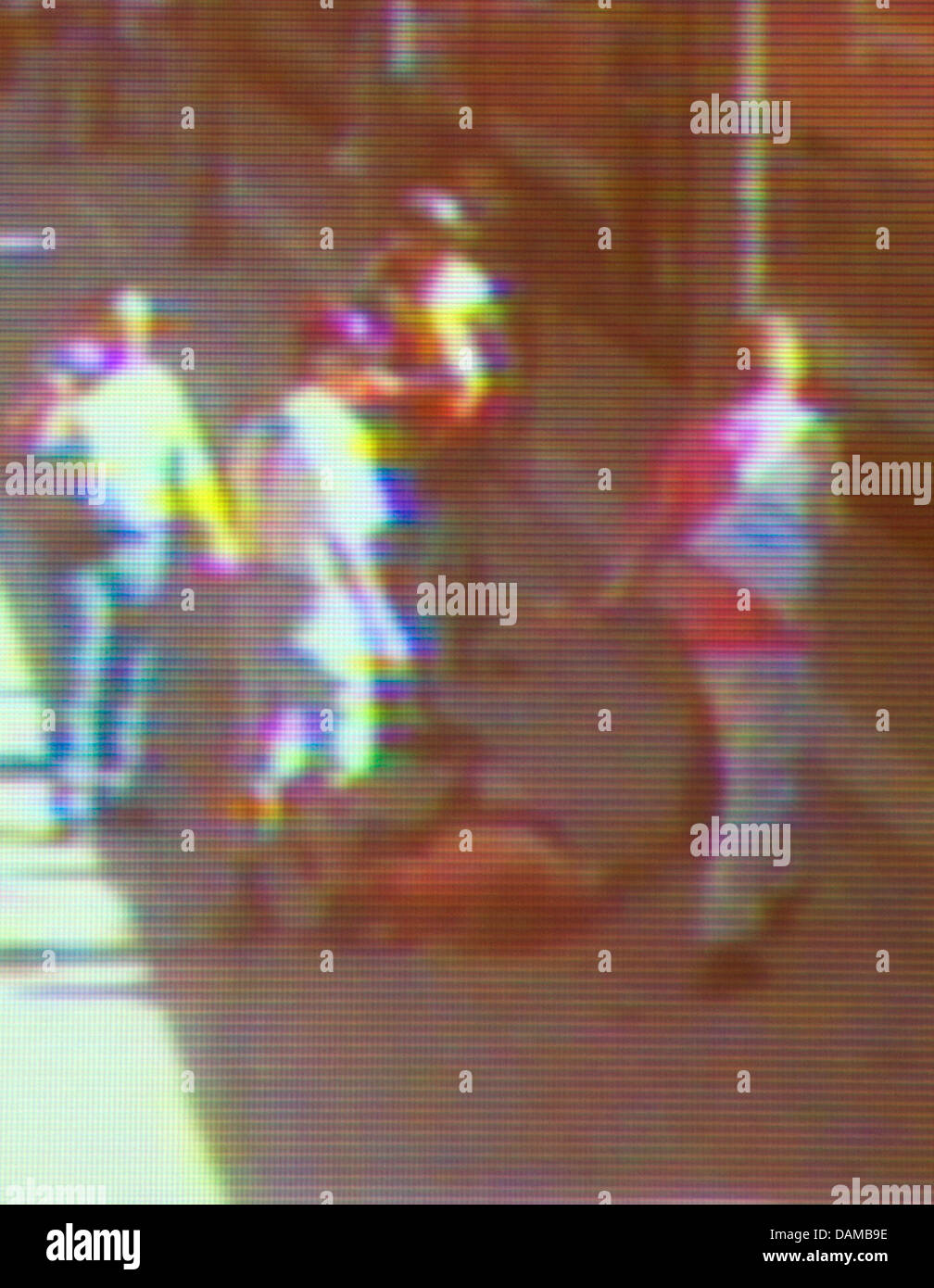 The photo released by the police at a press conference and taken from a surveillance camera shows the victim lying - Stock Image